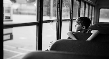 Back to school portrait of NH boy and his school bus