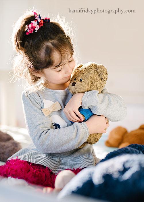 Groton MA preschooler holds her special stuffed bear photo